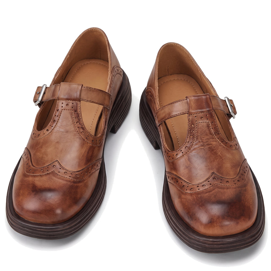 Women's brogue-detail brown leather Mary Jane shoes pair on white